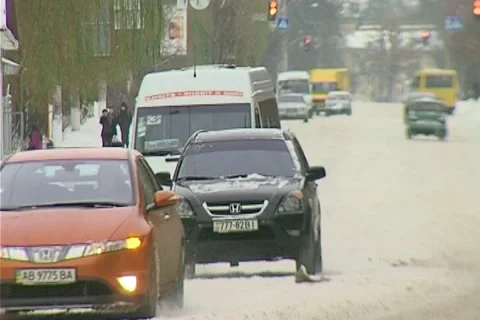 Snowing on road Stock Footage 1100469