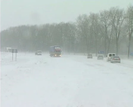 Snowing on road Stock-Footage 1100509