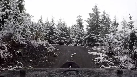 Snowing off-road uphill Stock Footage 172420974