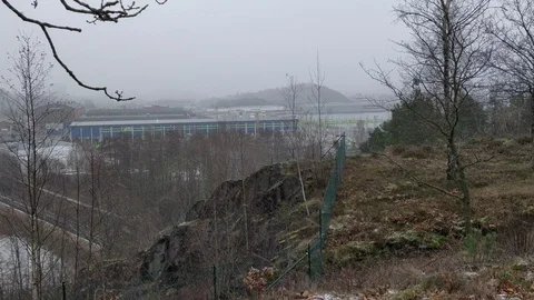 Snowing at Rural Hillside, Trees and Metal Fence Stock Footage 100719447