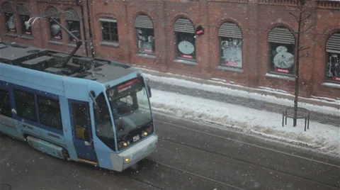 Snowing street with tram Stock Footage 39698257