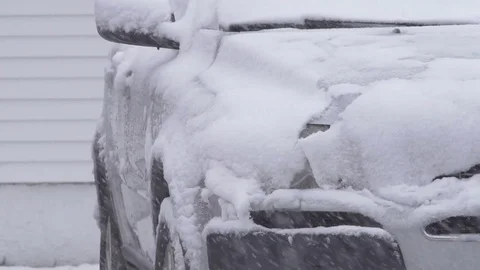 Snowing on suv in slow motion Stock Footage 73373374