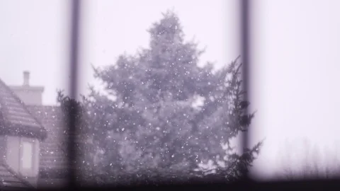 Snowing Through Frosted Window Pane Rack Focus Depth Of Field Stock Footage 87845537