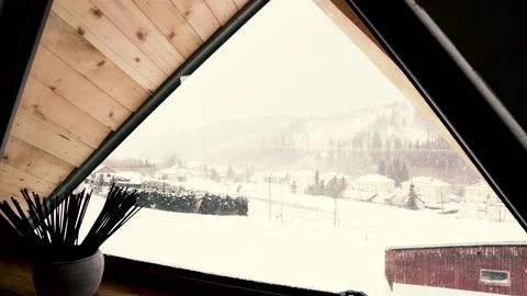 Snowing Through the Triangle Window. Unique Window View With Snow Outside. Stock Footage 146838717