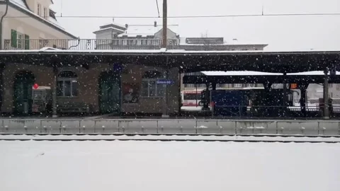 Snowing at train station Stock Footage 247036696
