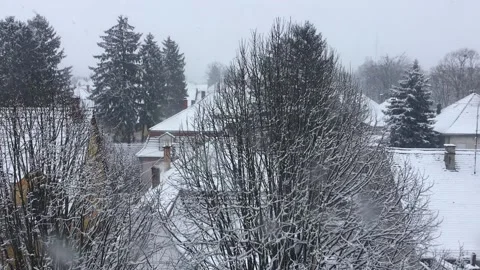 Snowing winter view of rooftops in Kaposvar, Hungary, 2021 Stock Footage 147528385
