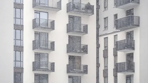 Snowing in the yard of modern new building Stock Footage 74634673