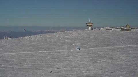 Snowkiting in the Winter Mountain 4K Stock Footage 76517630