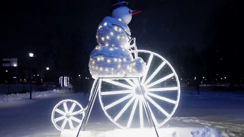 Snowman on a bicycle Stock Footage 257137041