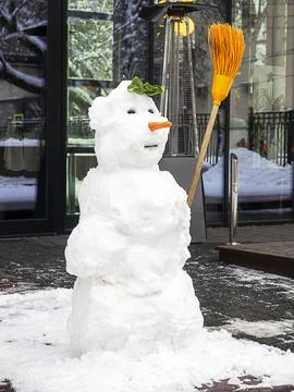 Snowman with a broom . Winter Stock Photos