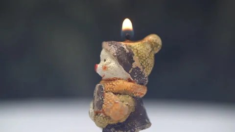 Snowman candle on black background Stock Footage 161337363