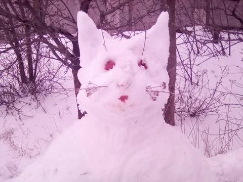 Snowman in the form of a cat Stock Photos