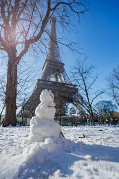 Snowman in front of Eiffel Tower on a winter day, Paris, France Stock Photos