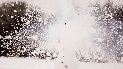 Snowman head explode and burst apart, smoke cloud fly away by wind Stock Footage 84315736