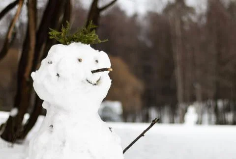 A snowman in a park Stock Photos