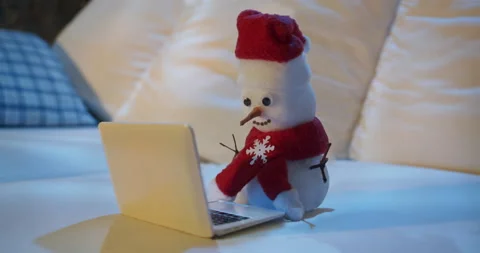 Snowman in Santa hat using laptop, notebook. Winter, Christmas online concept Stock-Footage 226046116