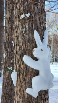 A snowman in the shape of a bunny Stock Photos