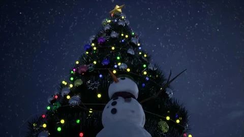 Snowman Standing in Front of a Large Decorated Christmas Tree with Lights Stock Footage 325636546