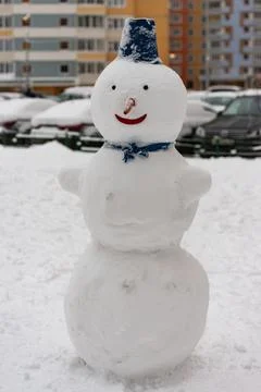 Snowman in town Stock Photos