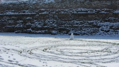 Snowman With Tracks Stock Photos