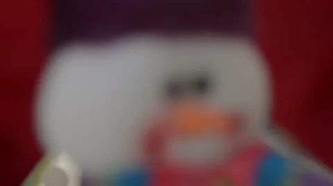 Snowman under new year tree on red background close-up Stock-Footage 67835998
