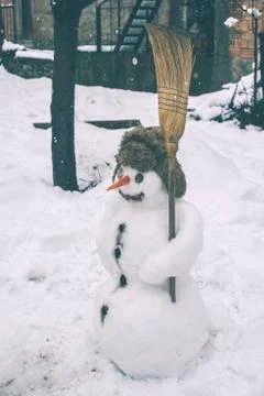 Snowman in the yard Stock Photos