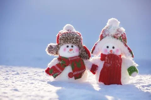 Snowmans on snow Stock Photos