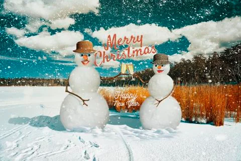 Snowmen on the background of the forest during a snowfall Stock Photos