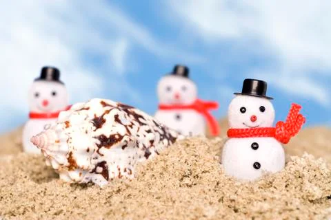 Snowmen on beach Stock Photos