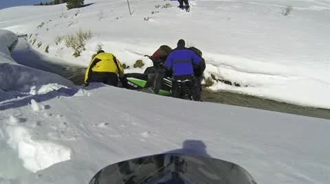 Snowmobile crash stuck in river friends HD 001 Stock Footage 21336053
