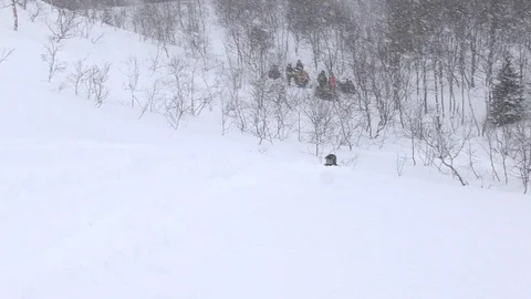 Snowmobile driver tries not to fall down among white valley Stock-Footage 112533902