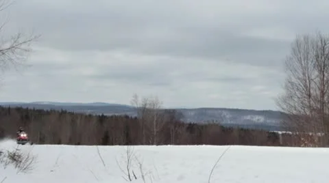 Snowmobile drives past Stock Footage 21738014