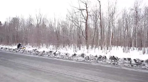 Snowmobile driving fast with passenger Stock Footage 60970919