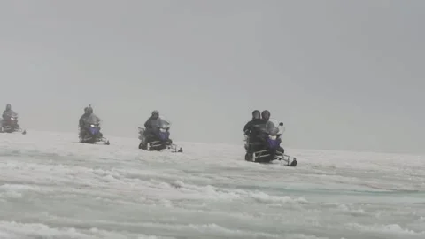 Snowmobile Driving Through the Blizzard Stock Footage 236725955