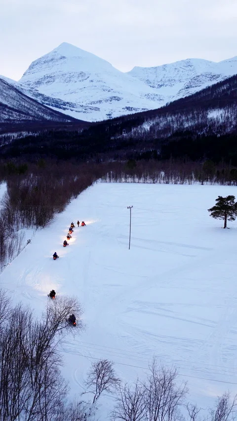 Snowmobile excursion and snowy adventure in Tromso countryside Stock Footage 345370114