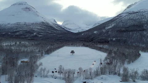 Snowmobile excursion in white snow-covered alpine countryside of Tromso Stock Footage 345725235
