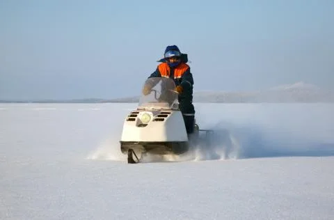 Snowmobile at full speed Stock Photos