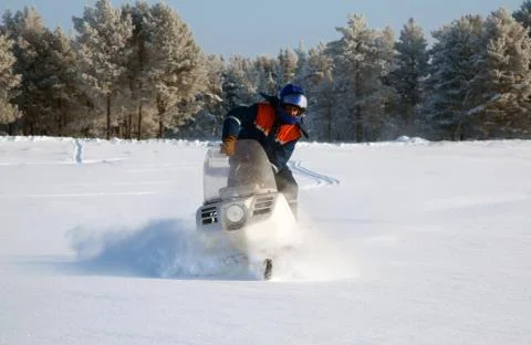 Snowmobile at full speed Stock Photos