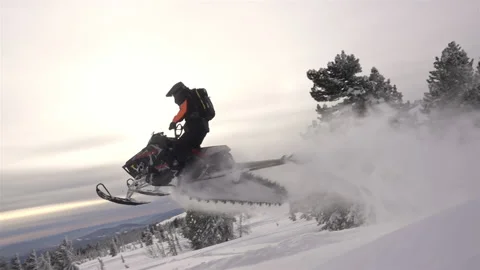Snowmobile jumps Stock Footage 149361261