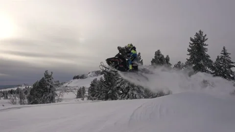 Snowmobile jumps Stock Footage 149361338