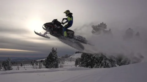 Snowmobile jumps Stock Footage 149361366