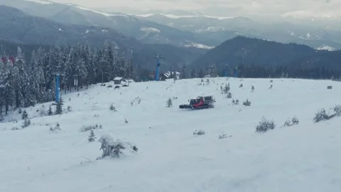Snowmobile machine at winter resort in snowy mountains Stock Footage 295659433