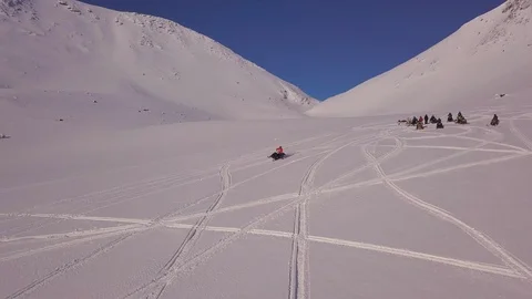 Snowmobile makes interesting drawing on highland surface Stock-Footage 112536282