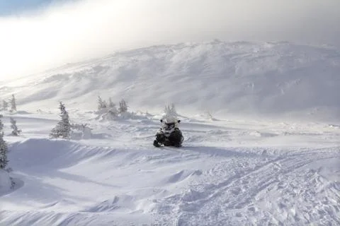 Snowmobile in the mountains Stock Photos