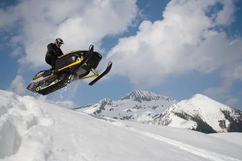 Snowmobile in the mountains Stock Photos