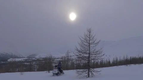 Snowmobile moves in Uralic mountains Stock Footage 282741731