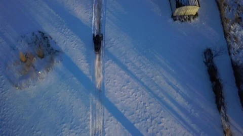 Snowmobile Overhead Long Shadows 動画素材 87046712