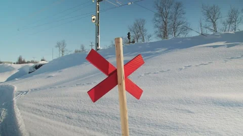 Snowmobile priority sign in hilly snow-covered terrain Stock Footage 248169512
