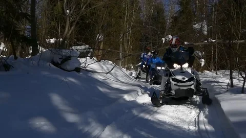 The snowmobile ride through the forest Stock Footage 89641342