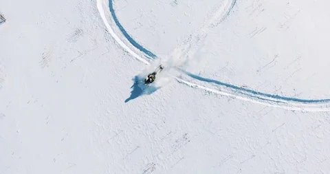 Snowmobile rides on the field, top view from the drone Stock Footage 87840720
